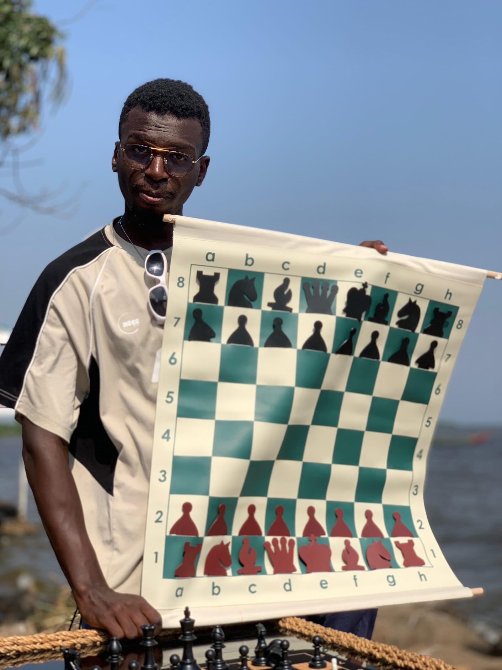 Coach presenting a roll-up teaching chess board